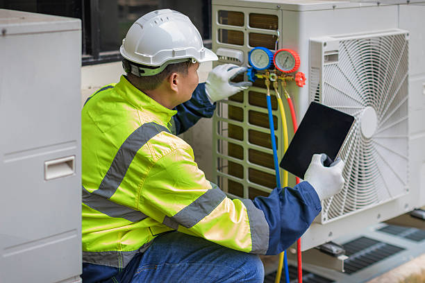 Professional Heat Pump Repair technician working in Bentonville, AR